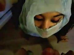 Submissive Arab woman receives facial.