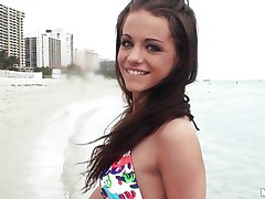 A very hot brunette meets a guy at the beach and after talking for a little while she takes him back to her hotel room where before you know it she's topless, showing off her nice boobs and sucking his fat dick. Will she suck his cock lengthy enough for him to cum all over her pretty young face?